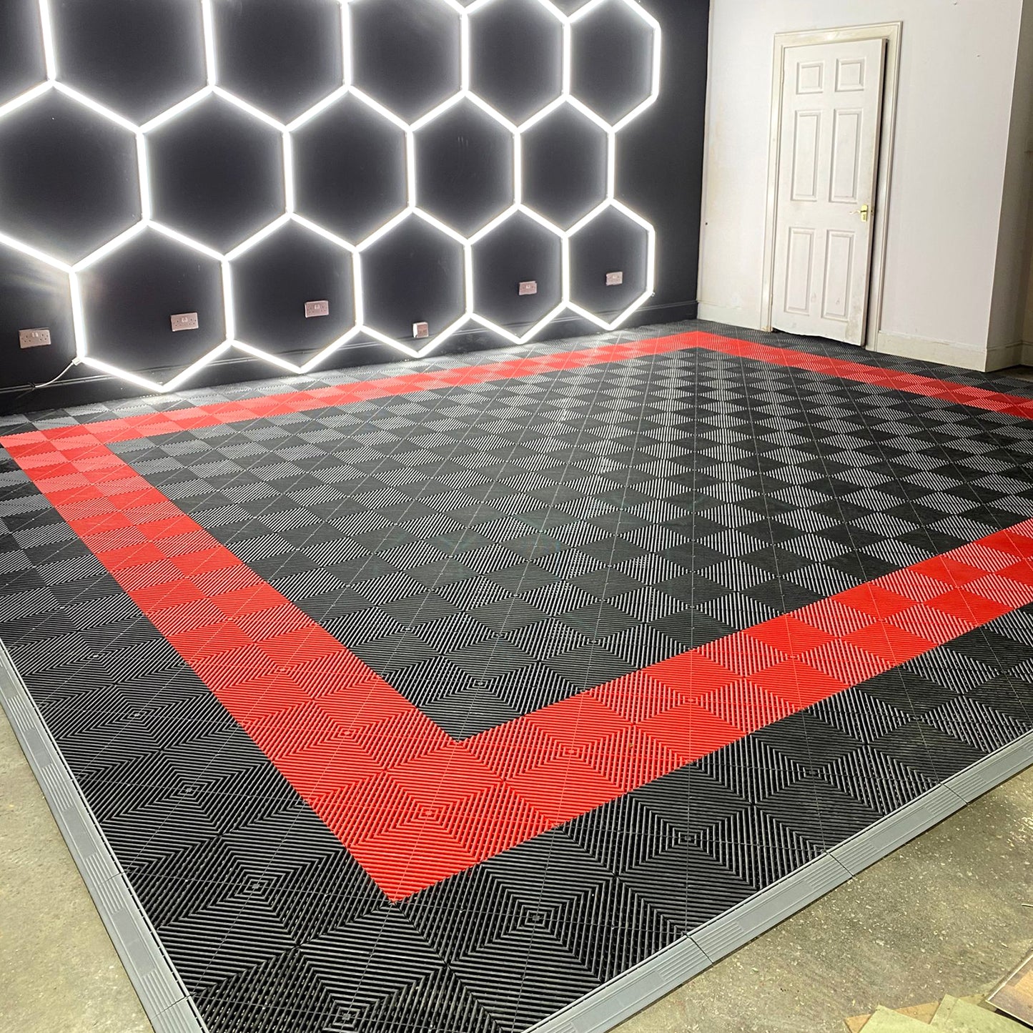 Top view of assembled plastic tile flooring showing seamless interlocking tiles for a uniform and clean appearance