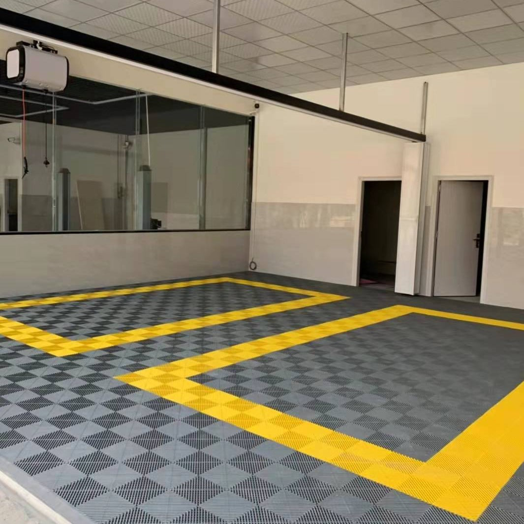 Plastic tile floor tile or mat in garage