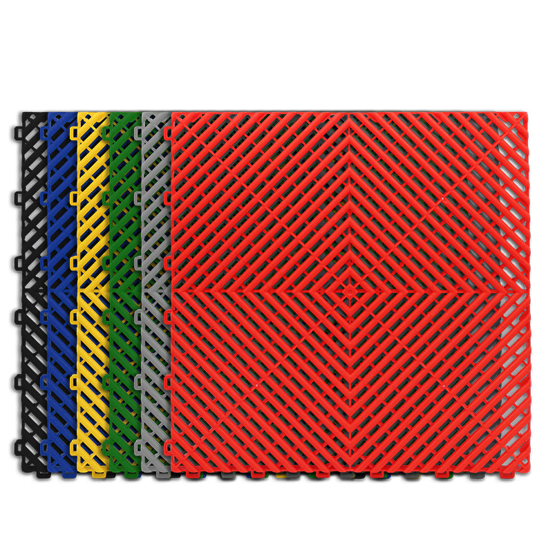 Plastic tile floor tile or mat in blue, black, grey, red, yellow, and green color