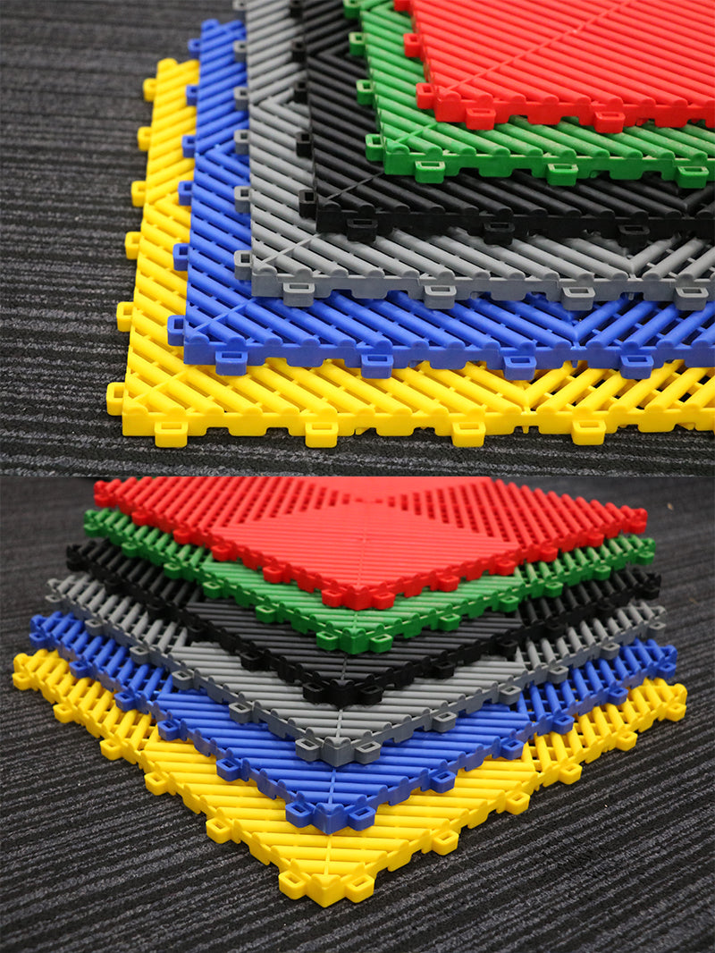 Plastic tile floor tile or mat in blue, black, grey, red, yellow, and green color
